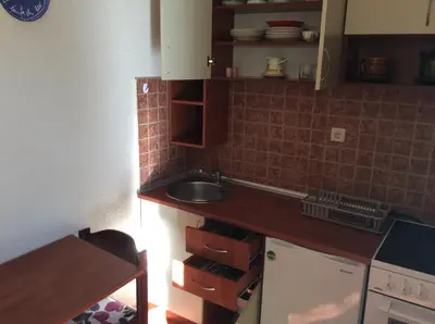 a kitchen with a sink and a counter top at Apartments Simo in Petrovac na Moru