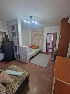 a living room with a bed and a couch in a room at Villa iTiS in Sutomore