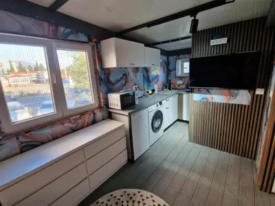 a small kitchen with a washer and dryer at Villa iTiS in Sutomore