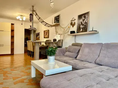 a living room with a couch and a table at Sea View Budva in Budva
