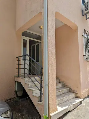 a building with a staircase in front of a building at Sea View Budva in Budva