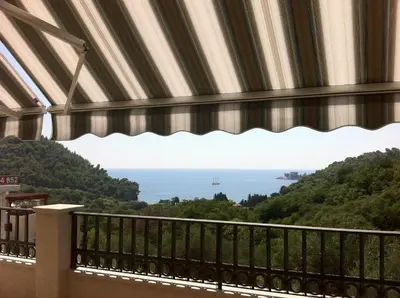 a view of the ocean from a balcony at Bay View Apartments in Petrovac na Moru
