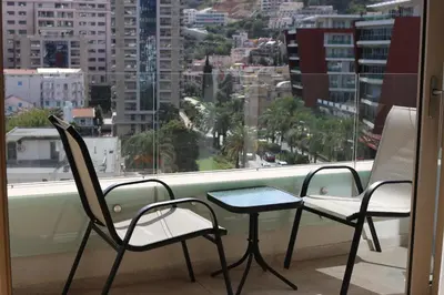 two chairs and a table on a balcony with a view at AKS Aparments - Wow in Budva