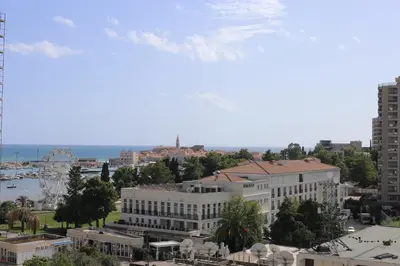 a view of a city with buildings and a harbor at AKS Aparments - Wow in Budva