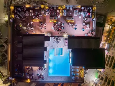 an overhead view of a group of people sitting around a pool at AKS Aparments - Wow in Budva