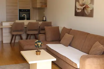 a living room with a couch and a table at AKS Aparments - Wow in Budva