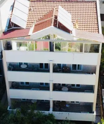 an aerial view of a white apartment building at Apartments Vila Anastasia in Budva