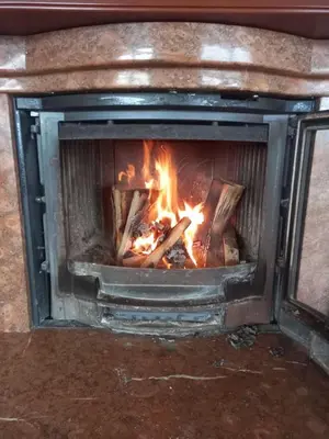 a fireplace with a fire in it at Baloci hills in Gornja Gorica
