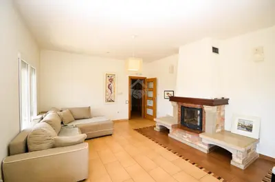 a living room with a couch and a fireplace at Baloci hills in Gornja Gorica