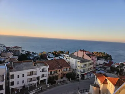 an aerial view of a city with the ocean at Eagles Locus Apartments in Ulcinj