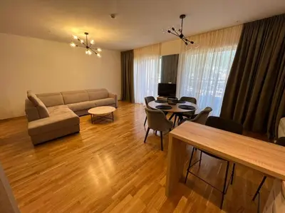 a living room with a couch and a table at Budva Harmonia in Boreti