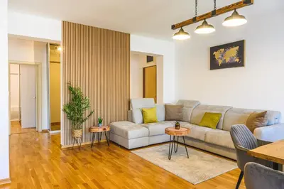 a living room with a couch and a table at Budva Harmonia in Boreti