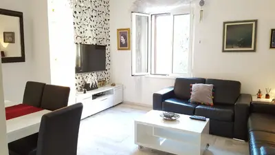 a living room with a couch and a table at Apartment Kiki in Kotor
