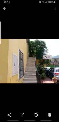 a staircase leading up to a building with a door at Apartment Kiki in Kotor
