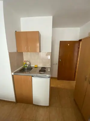 a small kitchen with a sink and a stove at Apartmani Jovanovic Canj in Čanj