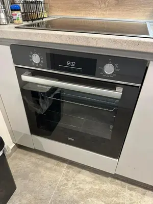 a black and silver oven in a kitchen at Sunshine Master apartment in Podgorica