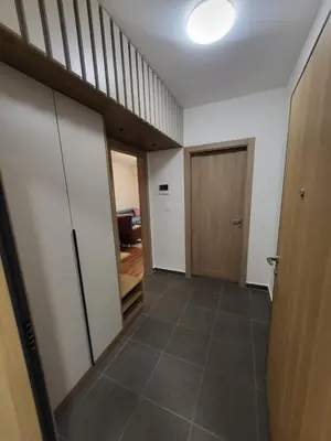 an empty hallway with a door and a room at Master apartment Podgorica in Podgorica