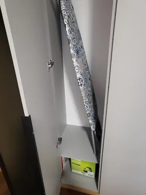 a mirror in a white cabinet with a curtain at Master apartment Podgorica in Podgorica