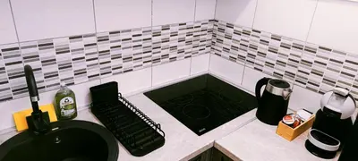 a bathroom with a black sink and a counter top at Apartman Luka in Trojica