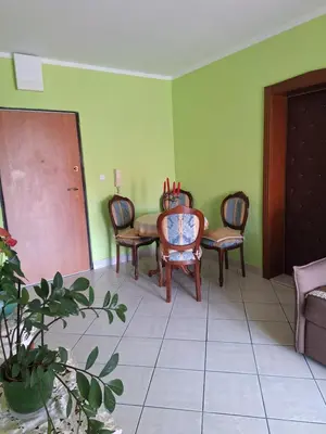 a dining room with a table and chairs in a room at Adriatic Luxury Flat in Budva