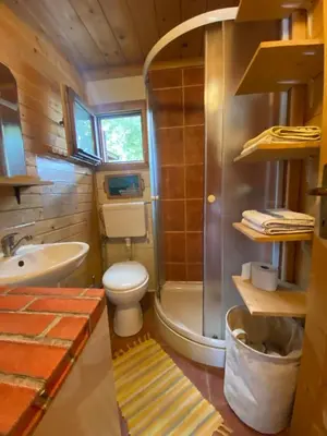 a bathroom with a toilet and a shower and a sink at Amazing &Magic houses- Ada Bojana in Gornji Štoj