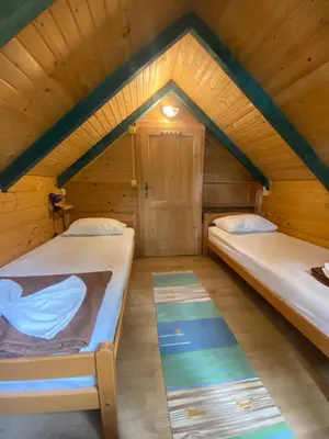 a room with two beds in a cabin at Amazing &Magic houses- Ada Bojana in Gornji Štoj