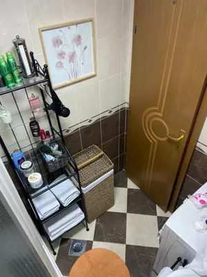 a bathroom with a towel rack next to a door at Sea view in Rafailovici