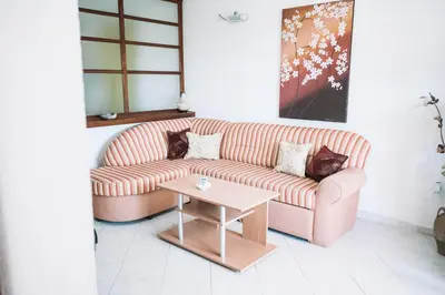 a living room with a couch and a table at Bivalvia Apartments in Ulcinj