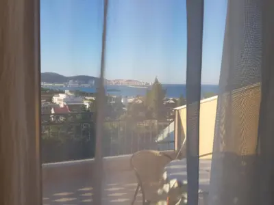 a view of the ocean from the balcony of a house at Apartment Dasic in Bar