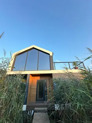a house with glass windows on the side of it at Amazonas Pirates 4 in Gornji Štoj