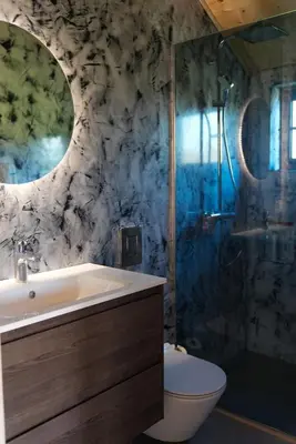 a bathroom with a sink and a shower and a toilet at Amazonas Pirates 4 in Gornji Štoj