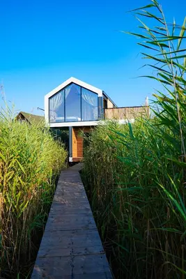 a glass house on a hill with a walkway at Amazonas Pirates 4 in Gornji Štoj