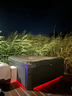 a suitcase sitting on the ground in front of a field at Amazonas Pirates 4 in Gornji Štoj