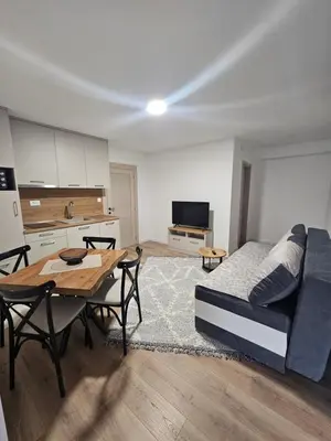 a living room with a couch and a table at Apartment Anita Cetinje in Cetinje