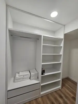 a walk in closet with white walls and white shelves at Apartment Anita Cetinje 2 in Cetinje