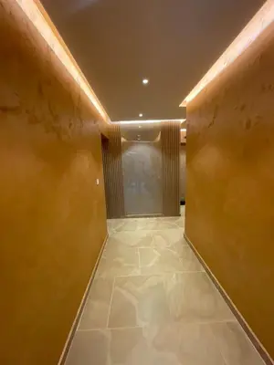 a hallway with a tile floor in a building at Apartments Zejak in Mitrovići