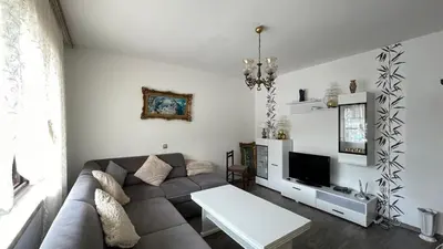 a living room with a couch and a tv at Happy Home in Lastva