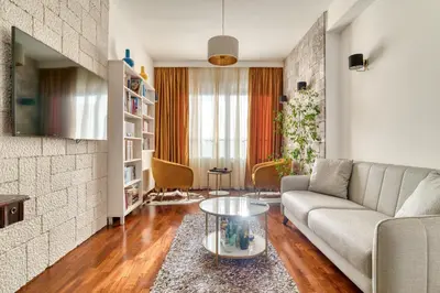 a living room with a couch and a table at Ivanovic residences in Budva
