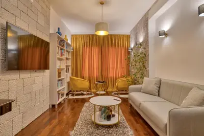 a living room with a couch and a table at Ivanovic residences in Budva