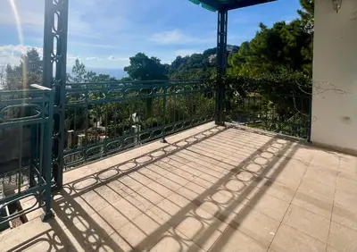 a balcony with a gate with a view at Blue Sky Villa in Brca