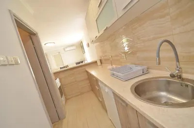 a kitchen with a sink and a counter top at Sunny apartment Tara in Kotor