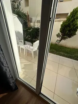 an open door to a patio with a table and chairs at Apartment Simona in Budva