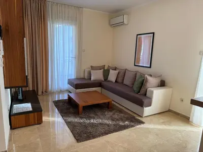 a living room with a couch and a coffee table at Viola Di Mare Apartments in Budva