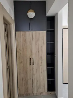 a large wooden door in a room with a ceiling at Apartman Vlado Podgorica 2 in Podgorica