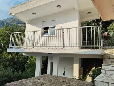 a view of a house with a balcony at Vrsutska 81 in Sutomore