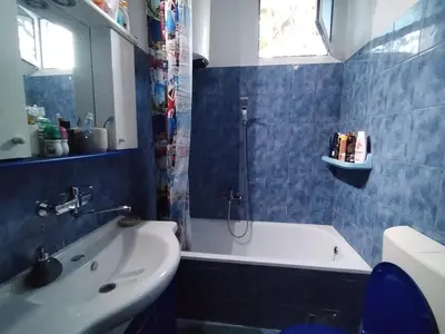 a bathroom with a shower and a tub and a sink at Vrsutska 81 in Sutomore