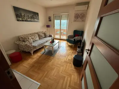 a living room with a couch and a table at Apartman 38 in Podgorica