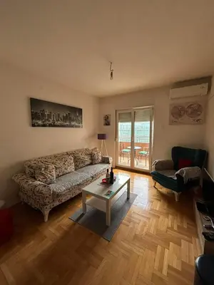 a living room with a couch and a coffee table at Apartman 38 in Podgorica