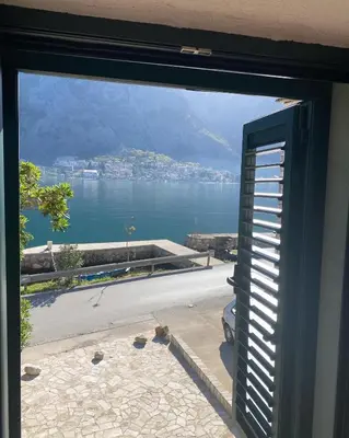 a view of the water from a window at Casa Behar in Kotor