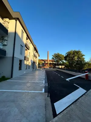 an empty parking lot next to a building at Apartman Princeza Ksenija in Podgorica